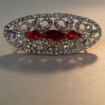 Red Chin & Shoulder Brooch